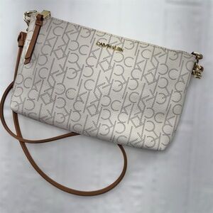 Calvin Klein Logo Print Crossbody Bag in Cream and Tan